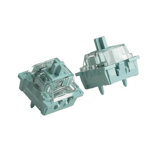 Two mechanical keyboard switches with a mint green plastic housing and clear transparent keycaps, shown from different angles on a solid white background.