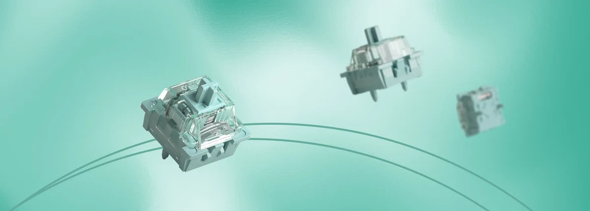 Three metallic mechanical switch components floating against a soft mint-green gradient background, with one larger switch in the foreground and two smaller ones behind it.