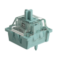 A single mechanical keyboard switch in a translucent mint green color, shown from a three-quarters perspective on a solid white background.
