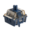 A mechanical keyboard switch with a dark blue case, transparent acrylic guard, and gold-toned internal contacts, shown on a solid white background.