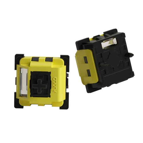Two small yellow and black electronic components shown on a plain white background, with one viewed from the top and the other from a side angle.