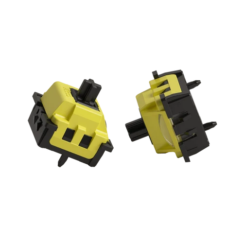 Two yellow and black tactile switch components shown from different angles on a plain white background.