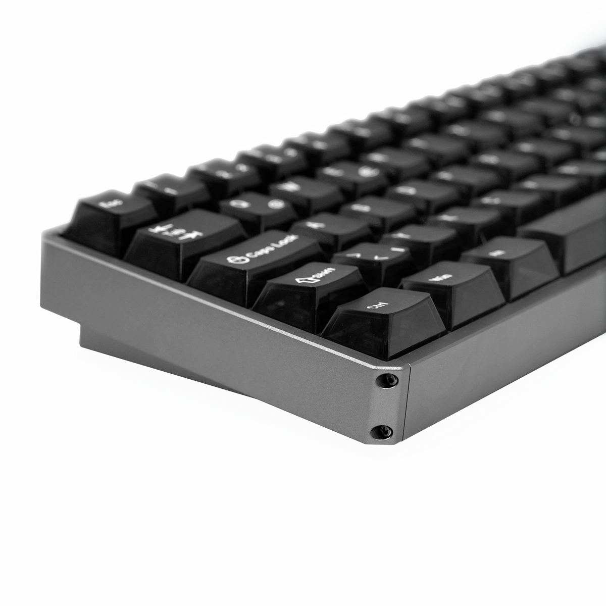Close-up of a mechanical keyboard showing the side profile with black keycaps, white legends, and a dark gray aluminum chassis on a white background.
