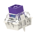 A mechanical keyboard switch keycap shown from an angled top-down view. The keycap features a solid purple top plate with a white cross symbol in the center, mounted on a clear and white switch housing.